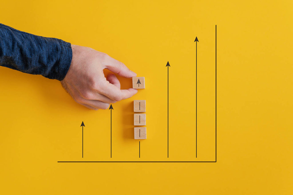 Conceptual image of stock market and economy growth - graph with upward pointing arrows