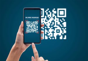 Hand using mobile smart phone scan QR code mockup template